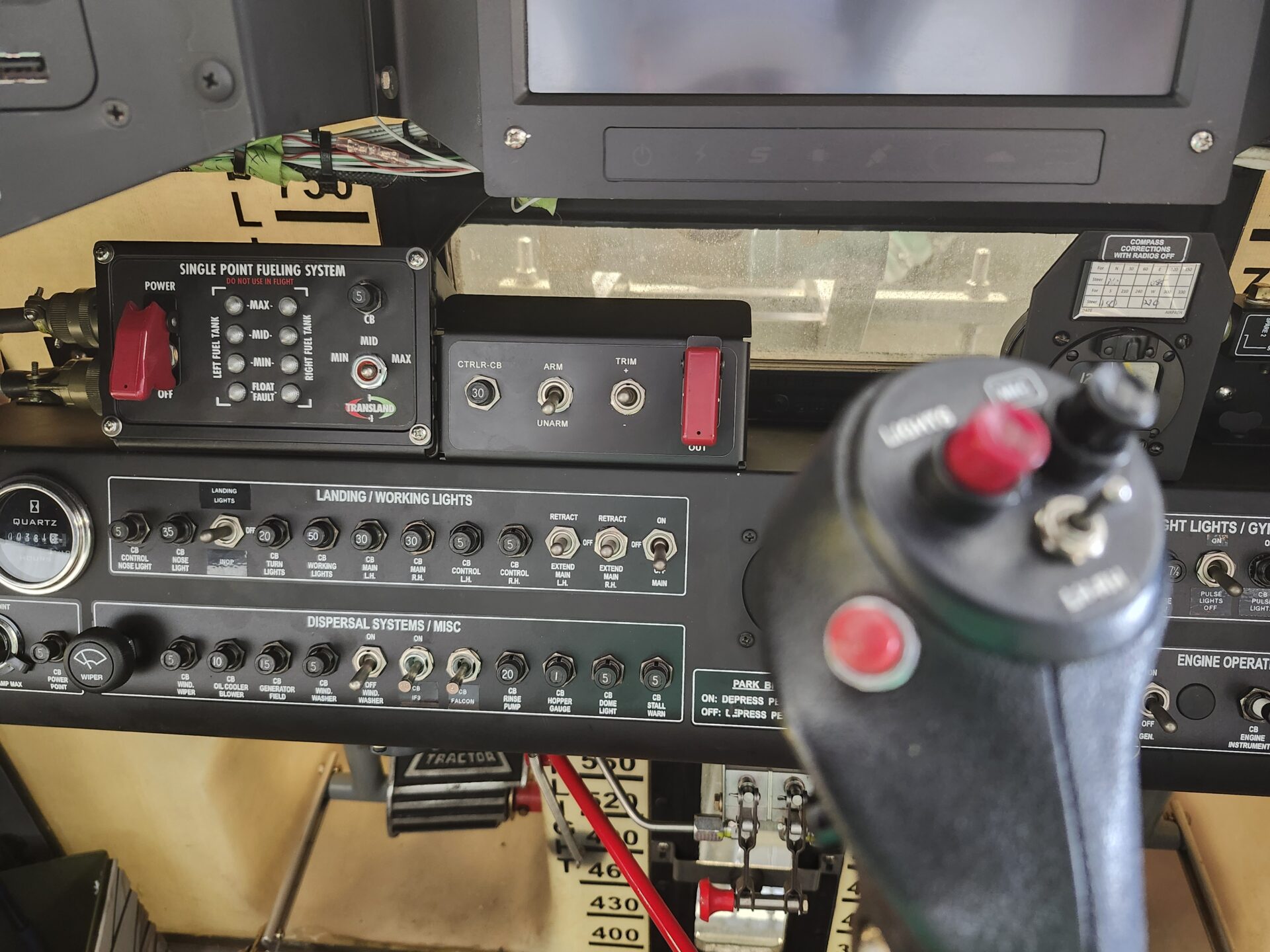 20240819_125459 Cockpit view showing the Transland Single Point Fueling System control panel and joystick in an Air Tractor aircraft.<br />